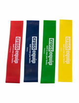 Mini Bands aus Latex – alle vier Stärken nebeneinander, von links Rot X-Heavy, Blau Heavy, Grün Medium und Gelb Light, jedes mit cross equip Aufdruck